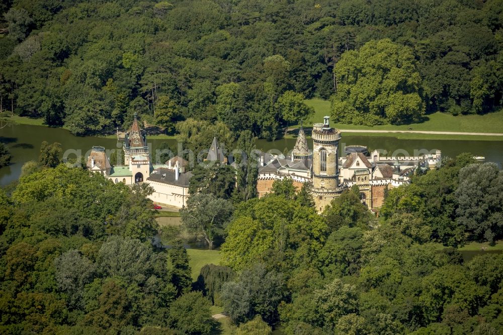 Aerial photograph Laxenburg - The Franzensburg in a forestland near Laxenburg in the state Lower Austria in Austria. The moated castle is located on an island and surrounded by the palace pond