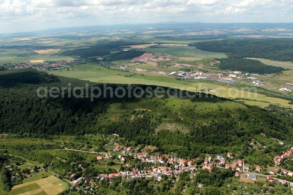 Aerial photograph Sondershausen - The Frauenberg mountain is a mountain spur the Hainleite protrudes into the city Sondershausen in Thuringia. Extensive archaeological excavations have been carried out in recent years on the mountain. On the crest are two radio towers. Below the mountain of the district Jechaburg can be seen with the St. Peter's Church. Behind the Fraunberg the Wipper the premises and salt heaps of potash plant Glueckauf Sondershausen are seen. In the background Nordhausen is prior to the relief of the southern Harz