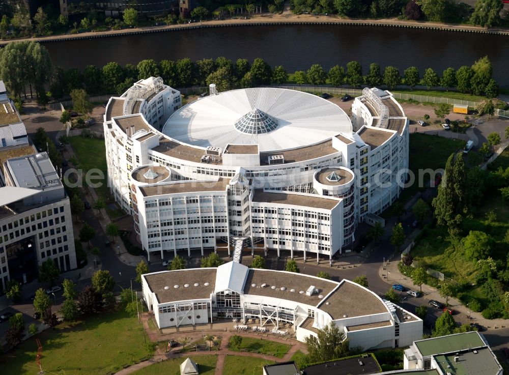 Berlin from above - White facade of the new building complex of the Fraunhofer-Institute Berlin, Berlin. Research Institute for Telecommunications in architecturally interesting semi-circular building on the River Spree in Berlin