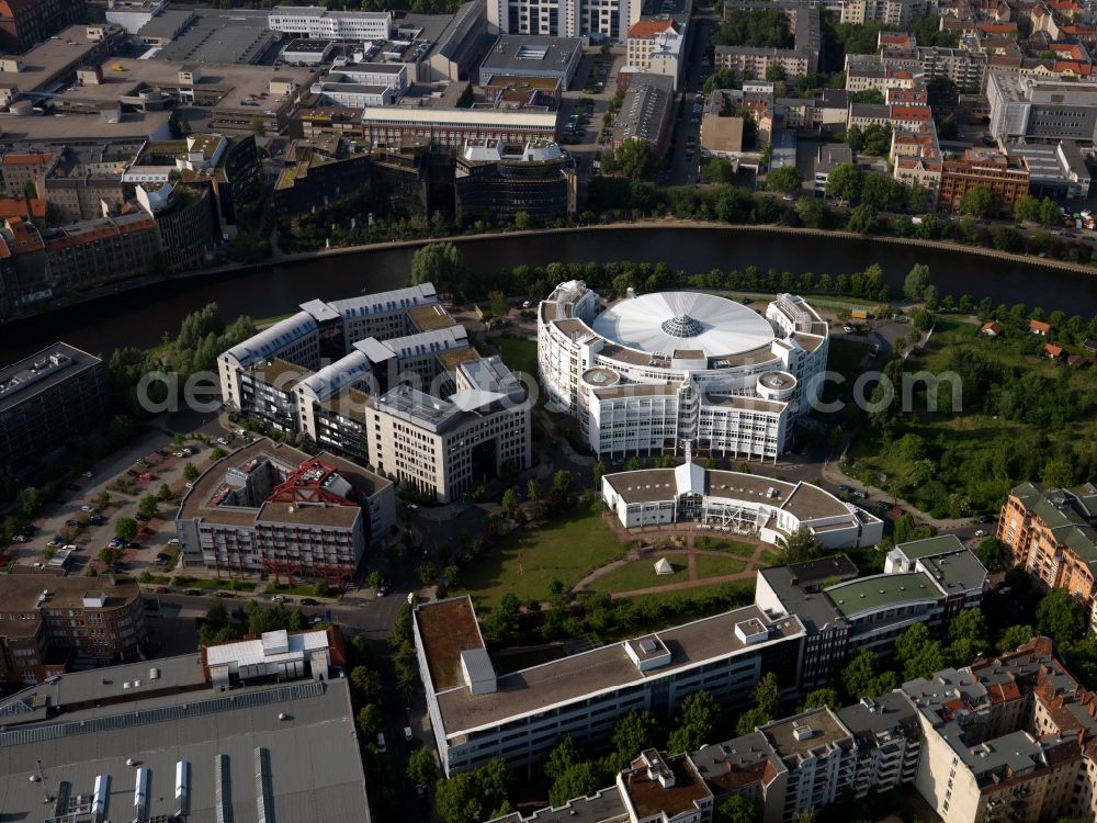 Berlin from the bird's eye view: White facade of the new building complex of the Fraunhofer-Institute Berlin, Berlin. Research Institute for Telecommunications in architecturally interesting semi-circular building on the River Spree in Berlin