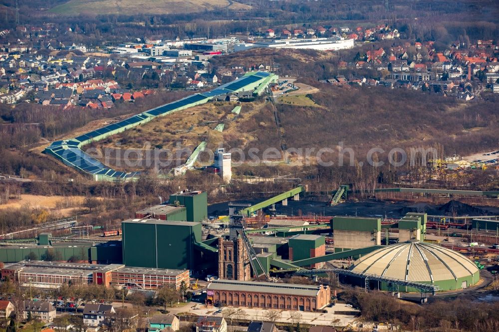 Aerial photograph Bottrop - Conveyors and mining pits at shaft tower Zeche Prosper II, Malakoffturm RAG Aktiengesellschaft mine Prosper-Haniel in Bottrop in North Rhine-Westphalia. In the background the INTERSPORT ALPIN CENTER