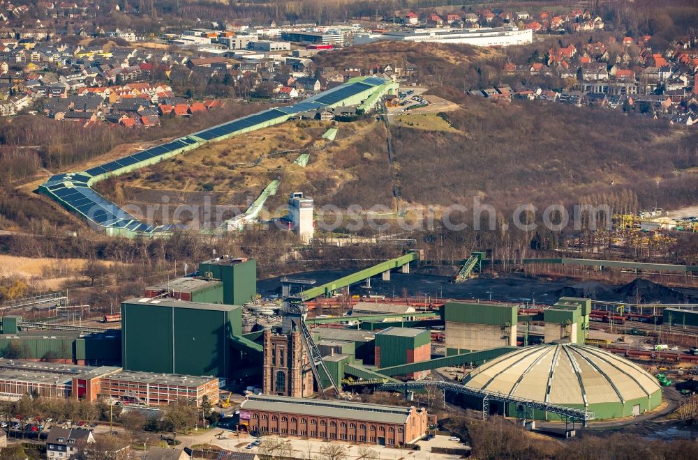 Bottrop from above - Conveyors and mining pits at shaft tower Zeche Prosper II, Malakoffturm RAG Aktiengesellschaft mine Prosper-Haniel in Bottrop in North Rhine-Westphalia. In the background the INTERSPORT ALPIN CENTER