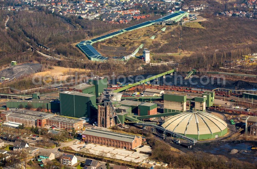 Bottrop from the bird's eye view: Conveyors and mining pits at shaft tower Zeche Prosper II, Malakoffturm RAG Aktiengesellschaft mine Prosper-Haniel in Bottrop in North Rhine-Westphalia. In the background the INTERSPORT ALPIN CENTER