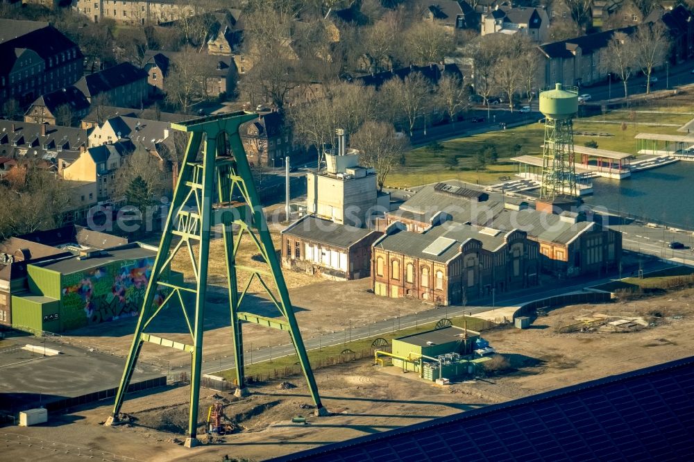 Dinslaken from the bird's eye view: Conveyors and mining pits at the headframe of Zentralwerkstatt Zeche Lohberg in Dinslaken in the state North Rhine-Westphalia, Germany