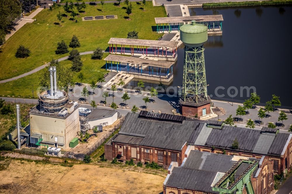 Aerial photograph Dinslaken - Conveyors and mining pits at the headframe of Zentralwerkstatt Zeche Lohberg in Dinslaken in the state North Rhine-Westphalia, Germany