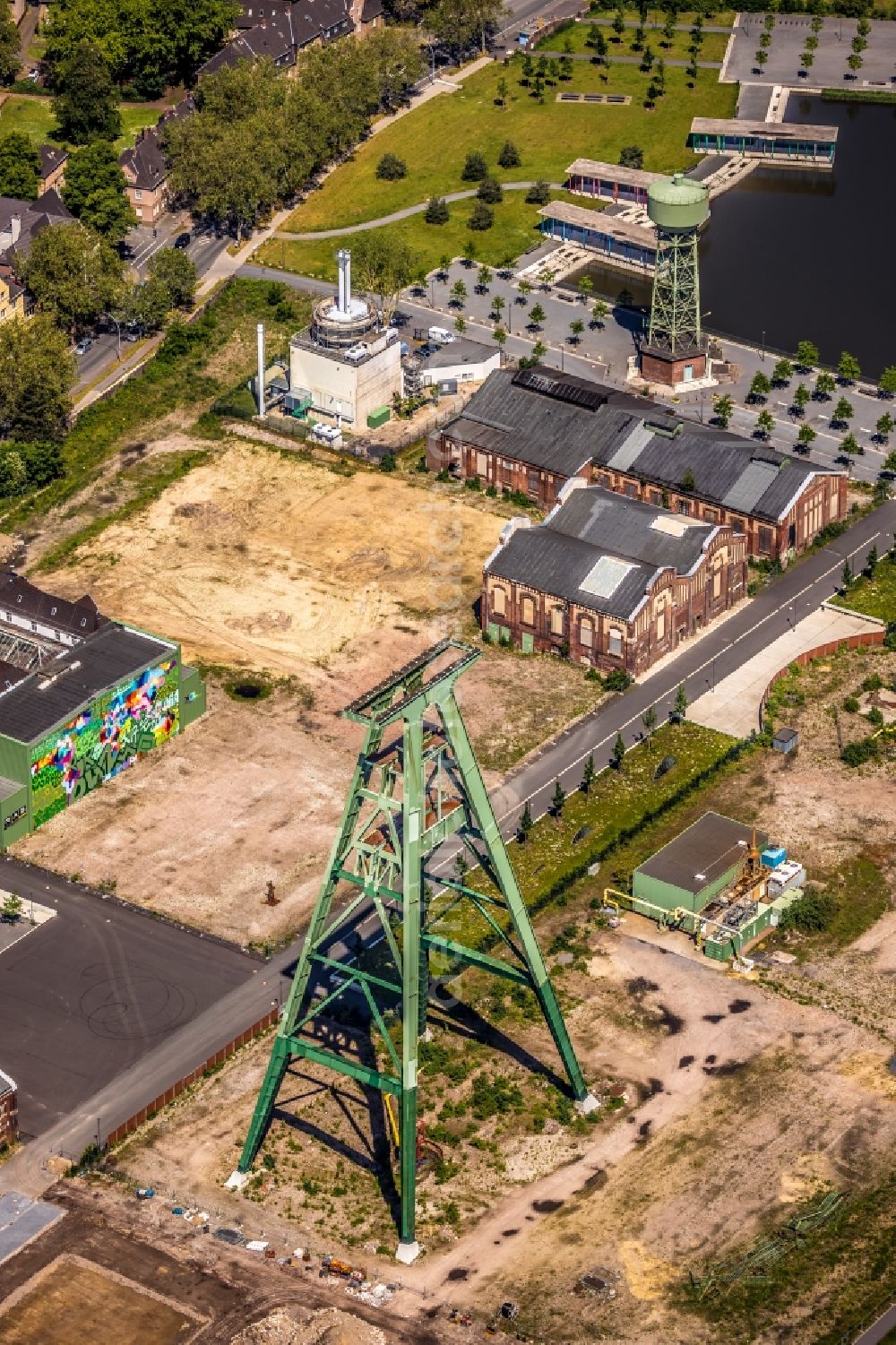 Dinslaken from above - Conveyors and mining pits at the headframe of Zentralwerkstatt Zeche Lohberg in Dinslaken in the state North Rhine-Westphalia, Germany