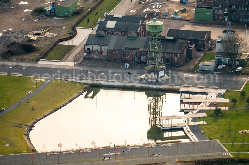 Dinslaken from the bird's eye view: Conveyors and mining pits at the headframe Bergwerk Lohberg in the district Ruhr Metropolitan Area in Dinslaken in the state North Rhine-Westphalia