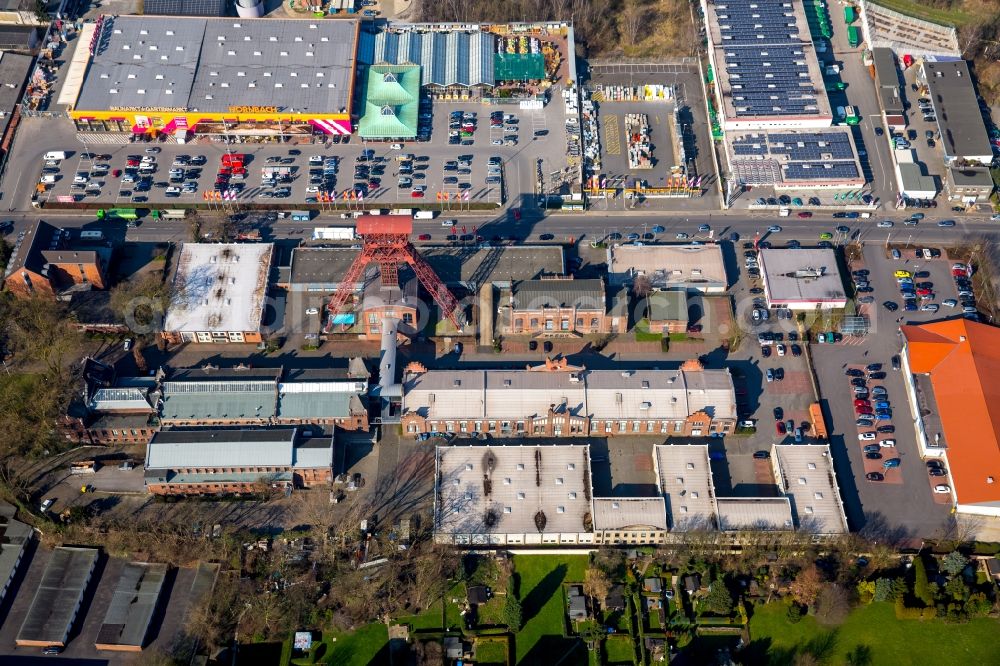 Aerial image Moers - Mining pits at the headframe of the coal mine opposite a Hornbach hardware store branch in Moers in the state of North Rhine-Westphalia