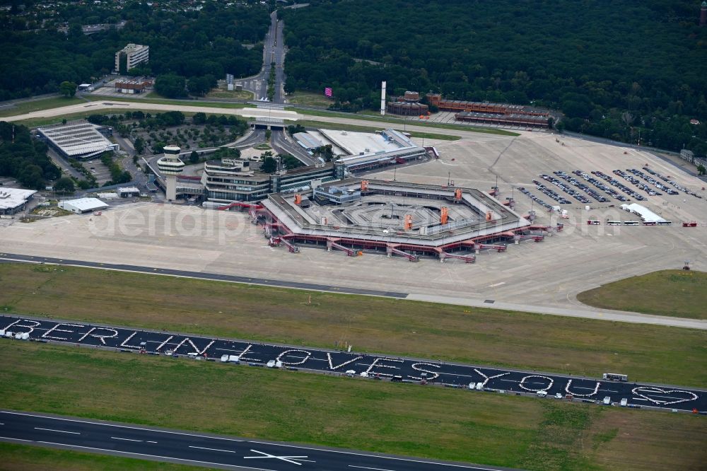 Berlin from above - Freedom Dinner on the blocked runway with a table arrangement to form letters of the words BERLIN LOVES YOU on the grounds of the former airport in the Tegel district in Berlin, Germany