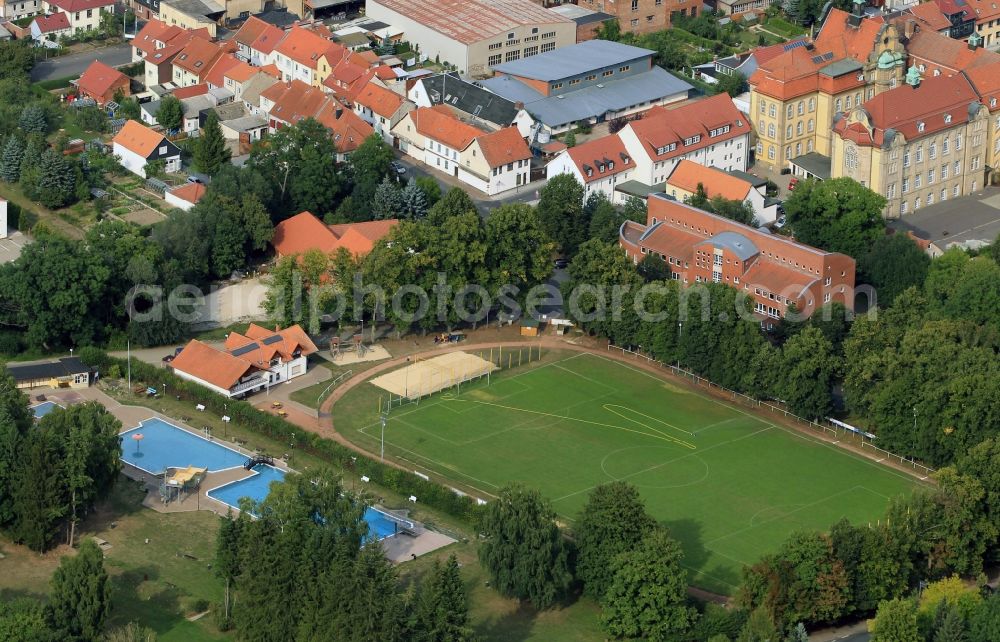 Dingelstädt from the bird's eye view: Outdoor pool and sports field by the side of the road Aue in Dingelstaedt in Thuringia