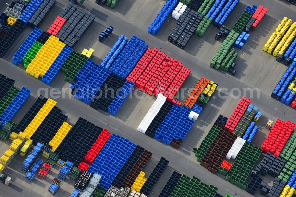 Neuruppin from above - Free storage space colorful plastic tonnes in production facilities of Otto Disposal Systems in Neuruppin in Brandenburg