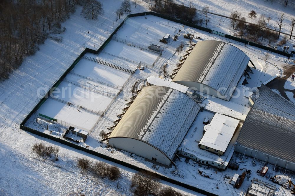 Magdeburg from the bird's eye view: Winterly snowy building of the leisure facility LIFE im Herrenkrug GmbH & Co. KG besides the road Herrenkrugstrasse in Magdeburg in the state Saxony-Anhalt