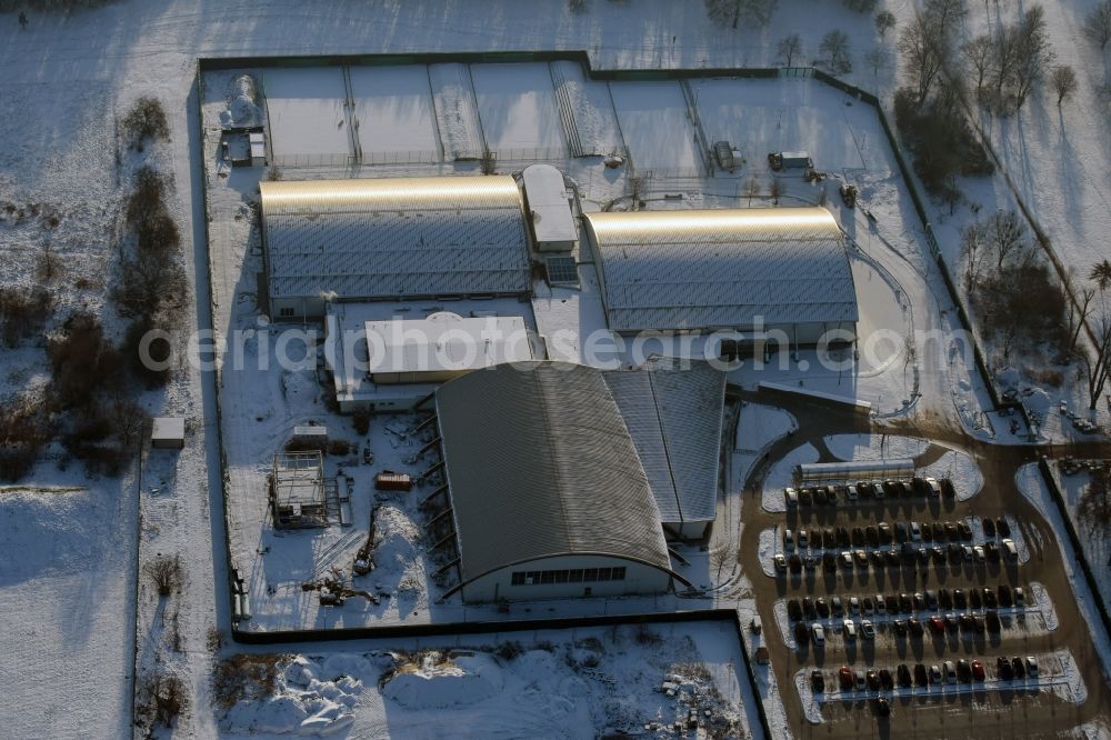 Magdeburg from above - Winterly snowy building of the leisure facility LIFE im Herrenkrug GmbH & Co. KG besides the road Herrenkrugstrasse in Magdeburg in the state Saxony-Anhalt