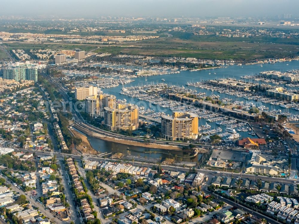 Aerial image Marina del Rey - Marina with a block of highrise buildings in Marina del Rey in California, USA. Marina del Rey is an unincorporated seaside community completely surrounded by the urban area of Los Angeles. Its Marina is the world's largest man-made small craft harbor