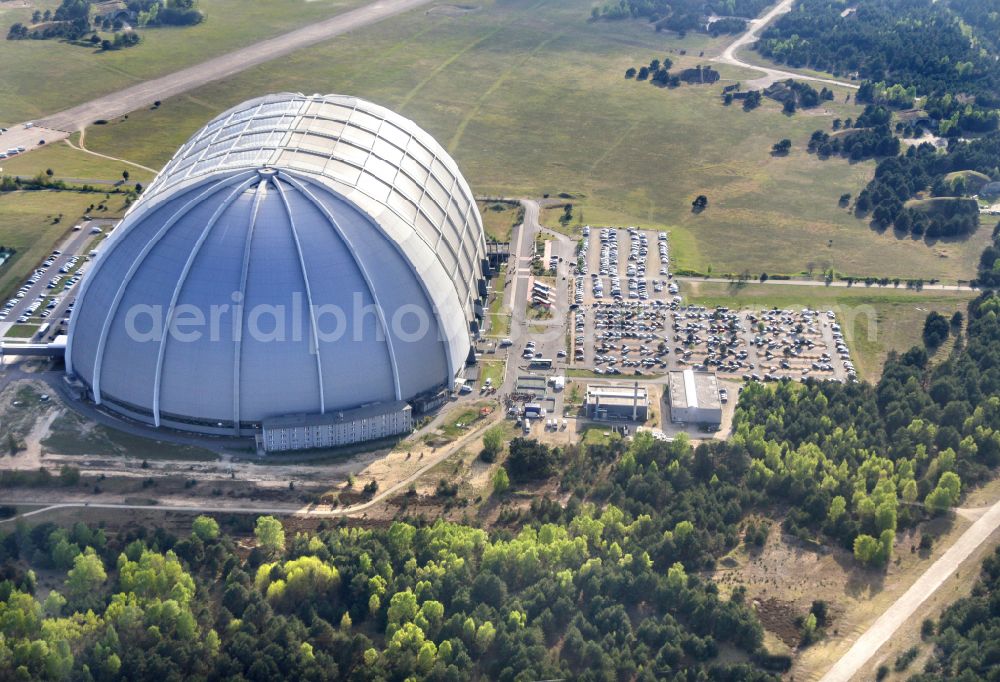 Krausnick from above - Complete complex of the Theme Park Tropical Islands with air hall, outdoor pool, campsite, holiday homes and former airfield on street Tropical-Islands-Allee in Krausnick in the state of Brandenburg, Germany