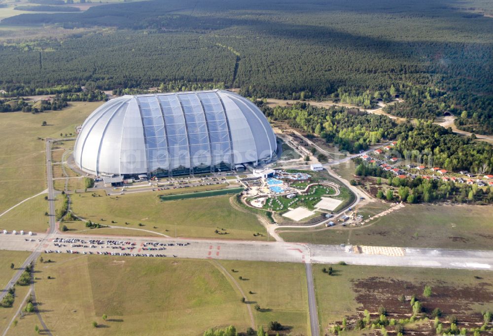 Krausnick from above - Complete complex of the Theme Park Tropical Islands with air hall, outdoor pool, campsite, holiday homes and former airfield on street Tropical-Islands-Allee in Krausnick in the state of Brandenburg, Germany