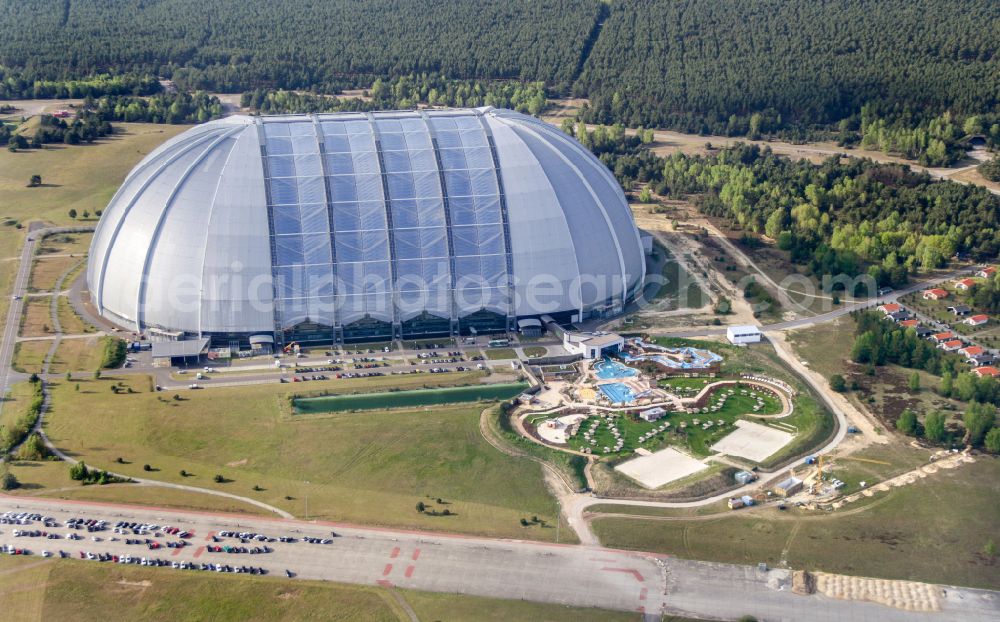 Krausnick from the bird's eye view: Complete complex of the Theme Park Tropical Islands with air hall, outdoor pool, campsite, holiday homes and former airfield on street Tropical-Islands-Allee in Krausnick in the state of Brandenburg, Germany