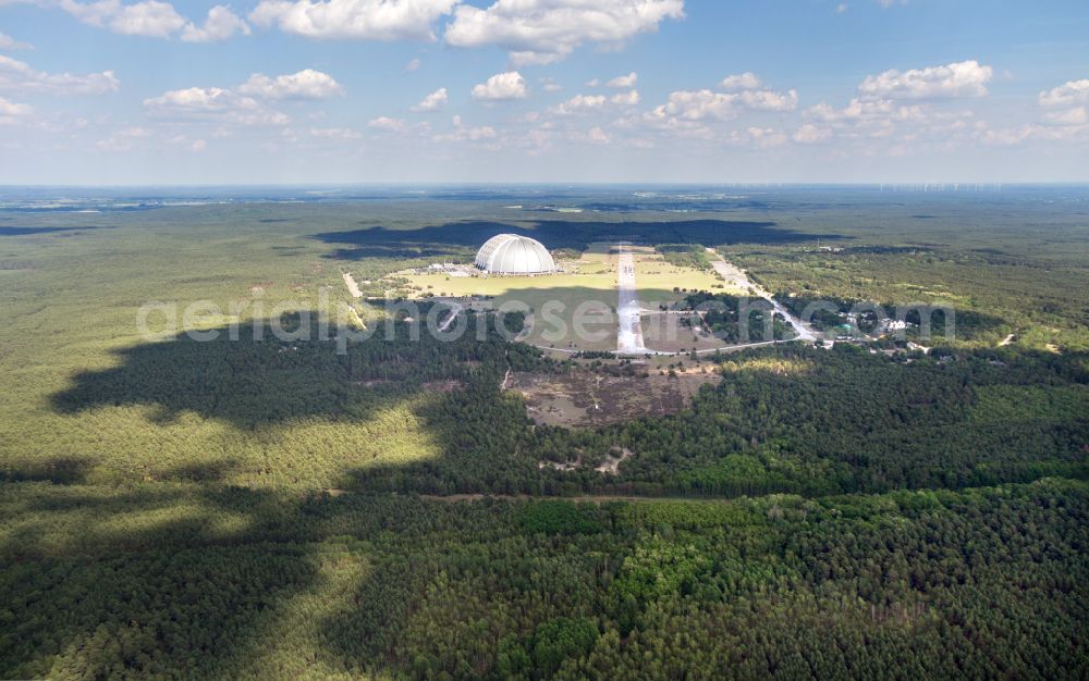 Krausnick from the bird's eye view: Complete complex of the Theme Park Tropical Islands with air hall, outdoor pool, campsite, holiday homes and former airfield on street Tropical-Islands-Allee in Krausnick in the state of Brandenburg, Germany