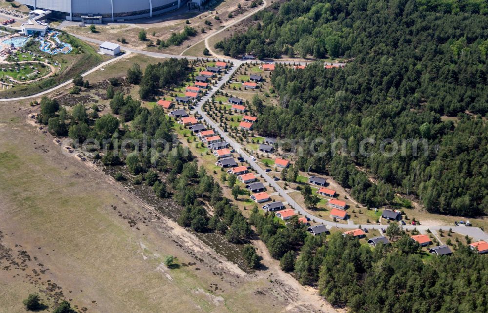 Aerial image Krausnick - Complete complex of the Theme Park Tropical Islands with air hall, outdoor pool, campsite, holiday homes and former airfield on street Tropical-Islands-Allee in Krausnick in the state of Brandenburg, Germany