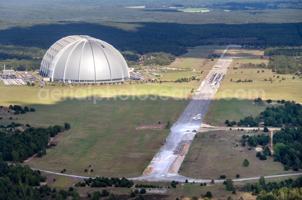 Aerial photograph Krausnick - Complete complex of the Theme Park Tropical Islands with air hall, outdoor pool, campsite, holiday homes and former airfield on street Tropical-Islands-Allee in Krausnick in the state of Brandenburg, Germany