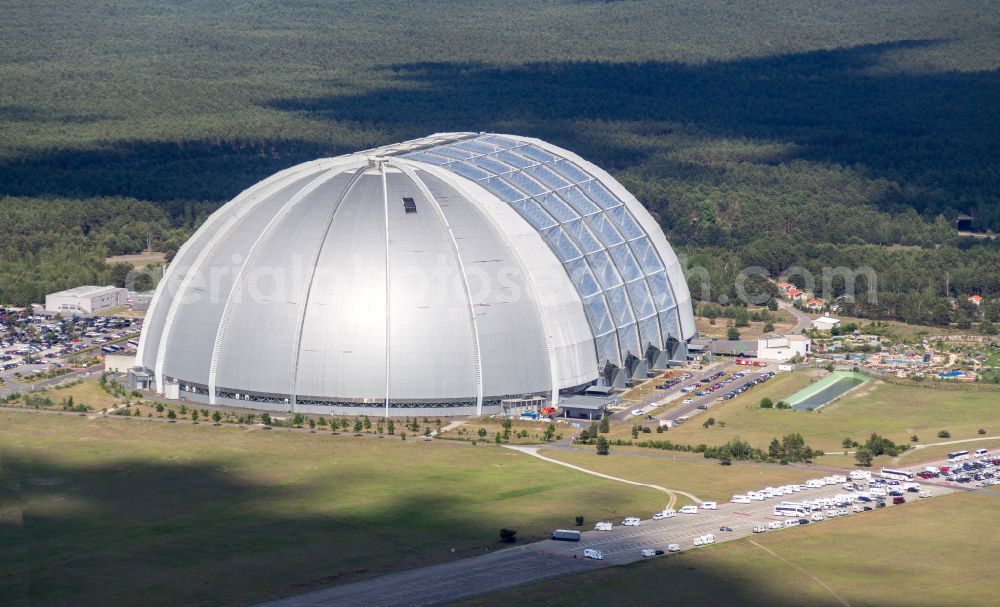 Krausnick from the bird's eye view: Complete complex of the Theme Park Tropical Islands with air hall, outdoor pool, campsite, holiday homes and former airfield on street Tropical-Islands-Allee in Krausnick in the state of Brandenburg, Germany