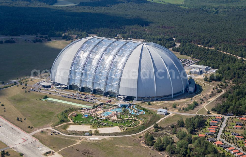 Aerial image Krausnick - Complete complex of the Theme Park Tropical Islands with air hall, outdoor pool, campsite, holiday homes and former airfield on street Tropical-Islands-Allee in Krausnick in the state of Brandenburg, Germany