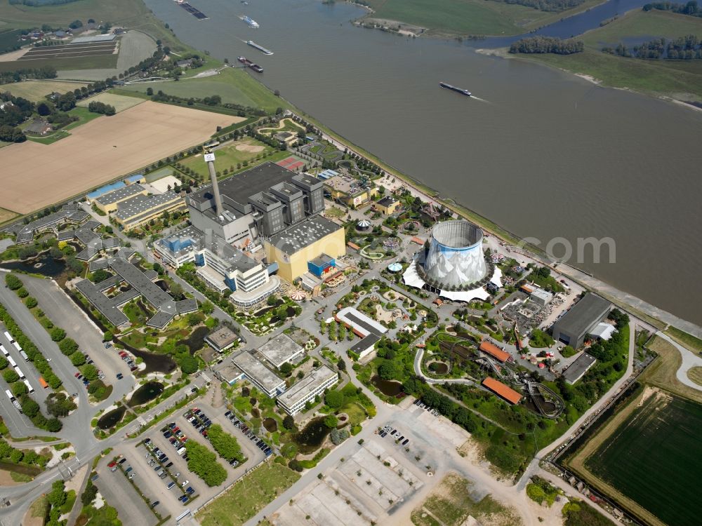 Aerial image Kalkar - Amusement Park Wunderland Kalkar in Kalkar in the state of North Rhine-Westphalia. The park on the Rhine riverbank was built in 1995 on site of the nuclear power plant Kalkar that never went online. The park was originally called Kernwasser-Wunderland and includes a conference centre and the theme park with a roller coaster, ferries wheel and climbing wall on the cooling tower