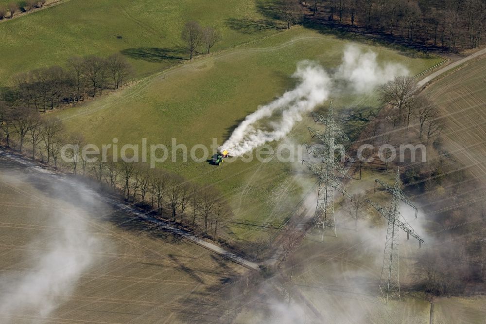 Marl from above - Spring farming work by liming a lawn in Marl in North Rhine-Westphalia