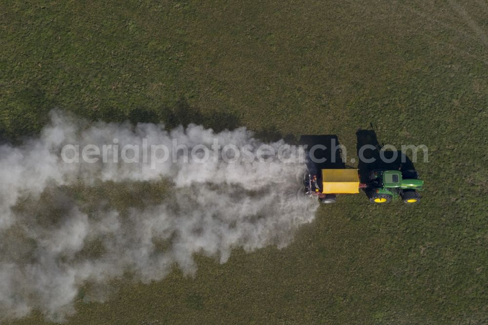 Marl from the bird's eye view: Spring farming work by liming a lawn in Marl in North Rhine-Westphalia