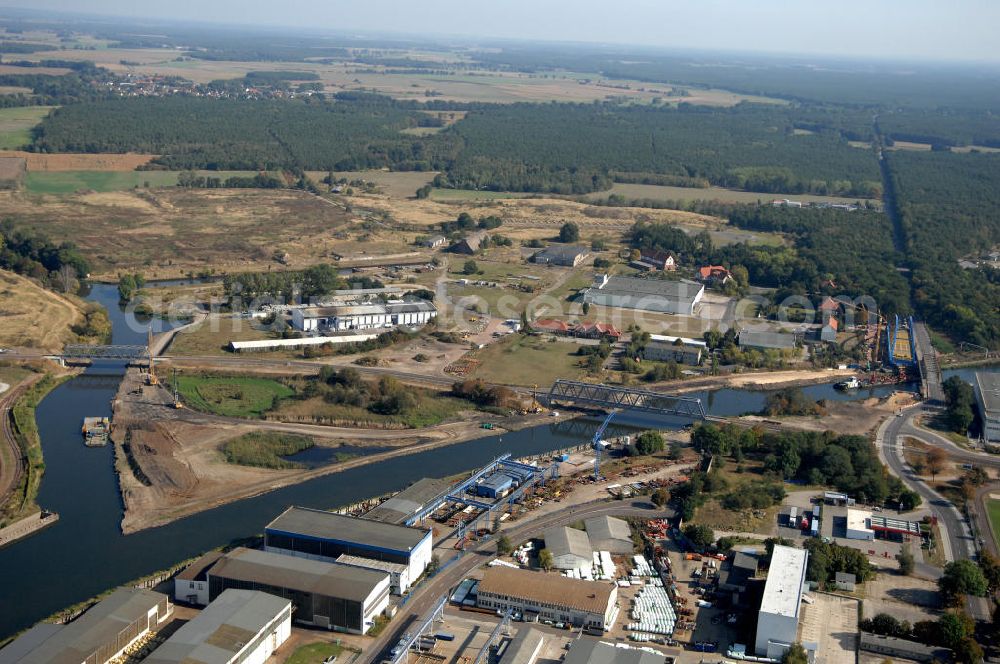 Genthin from the bird's eye view: Blick auf die Eisenbahnbrücke Genthin-Jerichow B15, die im Bau befindliche Friedensbrücke / Brücke des Friedens B16 und die Eisenbahnbrücke Roßdorfer Altkanal B26. Die Brücken überführen den Elbe-Havel-Kanal bei km 364,021 (B15) und bei km 364,229 (B16), sowie den Roßdorfer Altkanal / RAK bei km 0,360 (B26). Ein Projekt des WSV: Wasserstraßen-Neubauamt Magdeburg, 39106 Magdeburg, Tel. +49(0)391 535-0, email: wna-magdeburg@wsv.bund.de