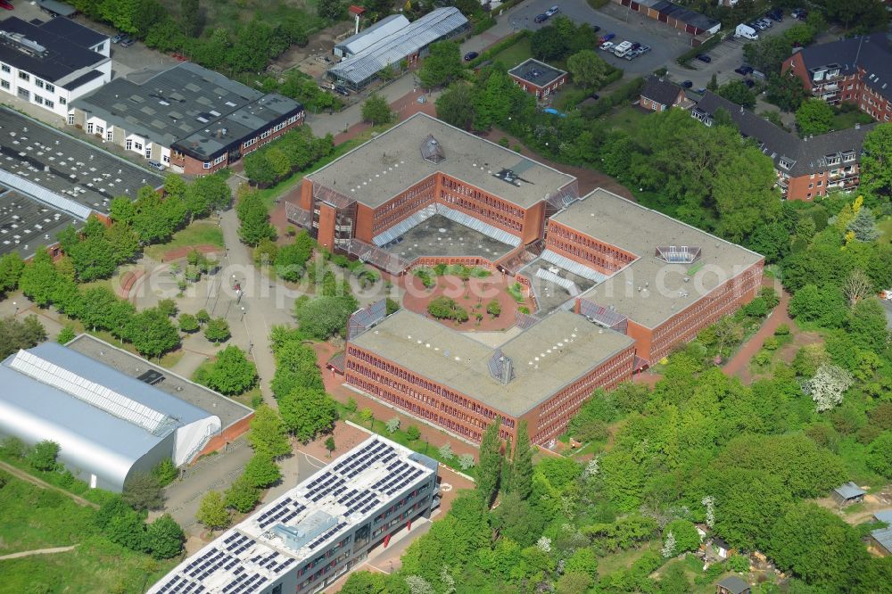 Lübeck from the bird's eye view: Friedrich-List-School in the St.Lorenz North part of Luebeck in the state of Schleswig-Holstein. The economic and Europe school with the red facade is surrounded by trees and includes a new building