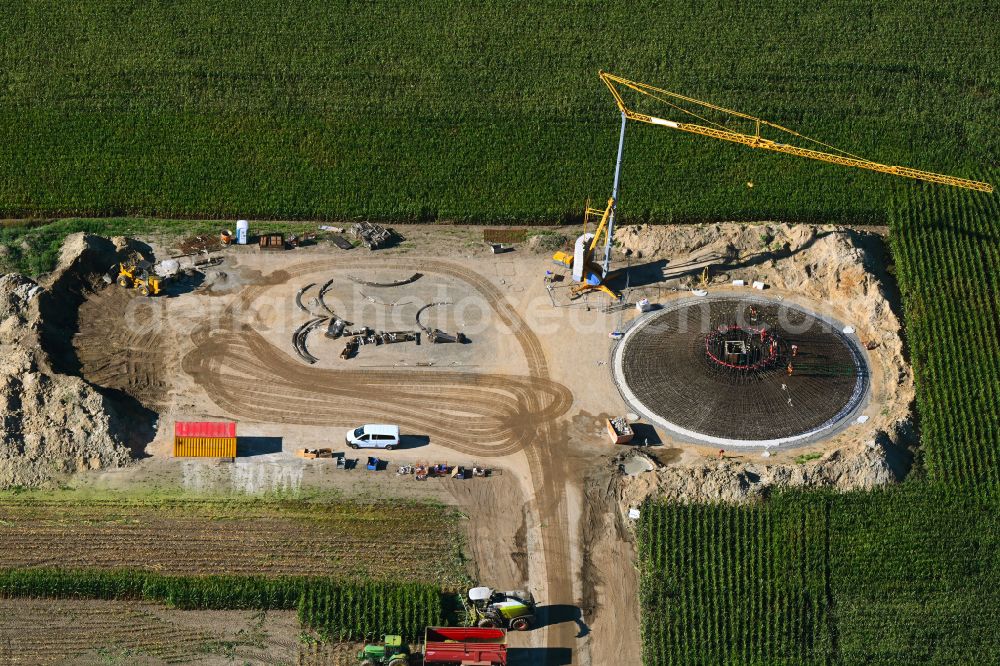 Gerdshagen from the bird's eye view: Construction site for the construction of the steel reinforcement of the foundation for the wind turbine tower assembly on a field in Gerdshagen in the state Brandenburg, Germany