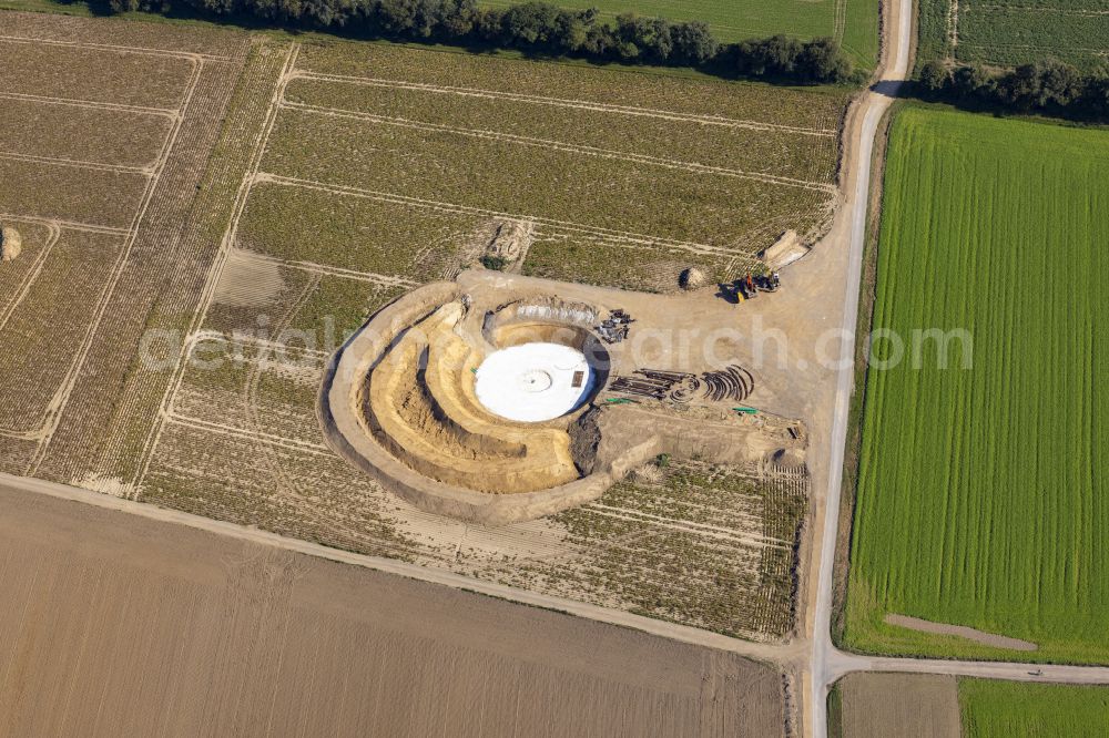 Würselen from the bird's eye view: Construction site for the construction of a steel and concrete foundation in a circular shape as a base for the installation of a WEA wind turbine - wind turbine on street Kesselgracht in Wuerselen in the state North Rhine-Westphalia, Germany