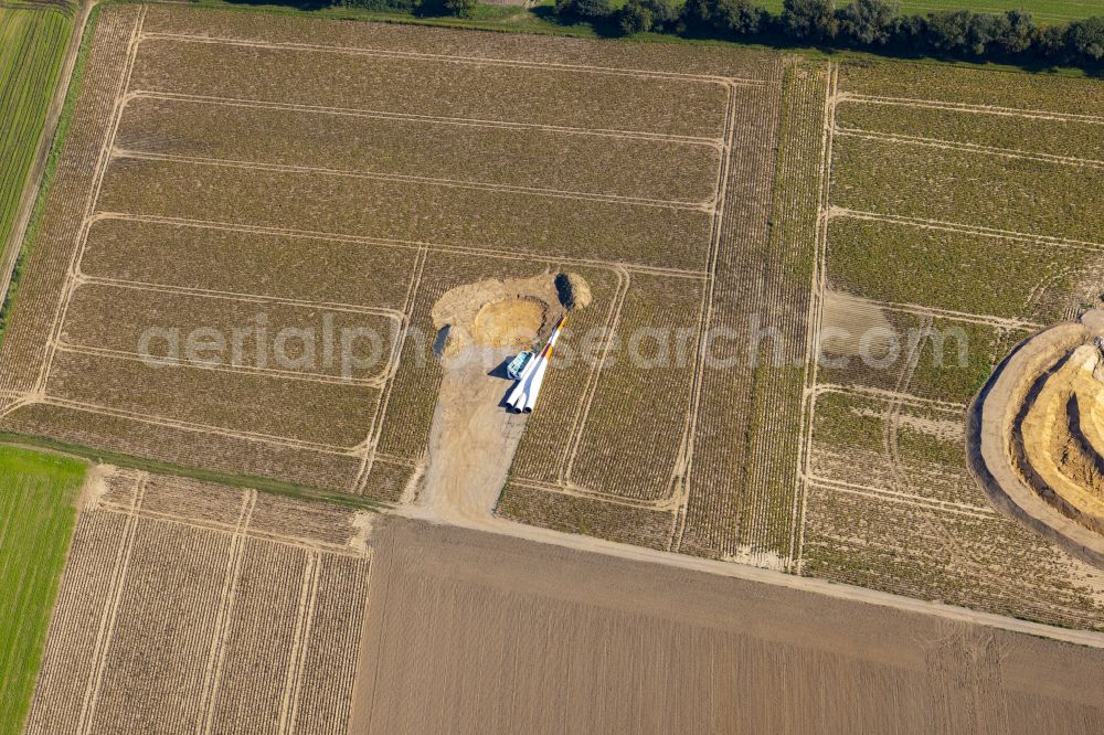 Würselen from the bird's eye view: Construction site for the construction of a steel and concrete foundation in a circular shape as a base for the installation of a WEA wind turbine - wind turbine on street Kesselgracht in Wuerselen in the state North Rhine-Westphalia, Germany