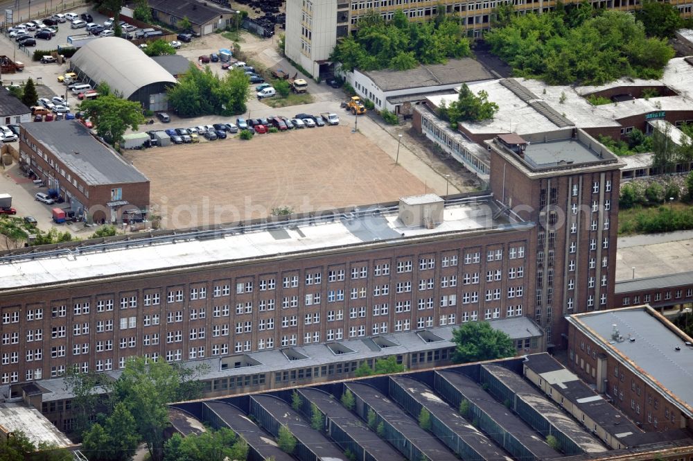 Berlin from above - The radio station in Berlin Treptow-Koepenick Nalepastrasse. The radio station was built in the 1950s on the River Spree and served until the turn as a broadcast center for all national GDR radio station. Since 2007, the building used again, providing recording studios, Bürofläschen, rehearsal rooms and meeting rooms to rent