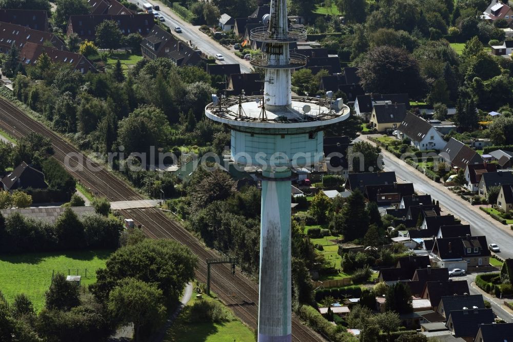 Heide from the bird's eye view: Funkturm and transmission system as basic network transmitter and Fernmeldeturm on street Neuwerkstrasse in Heide in the state Schleswig-Holstein, Germany