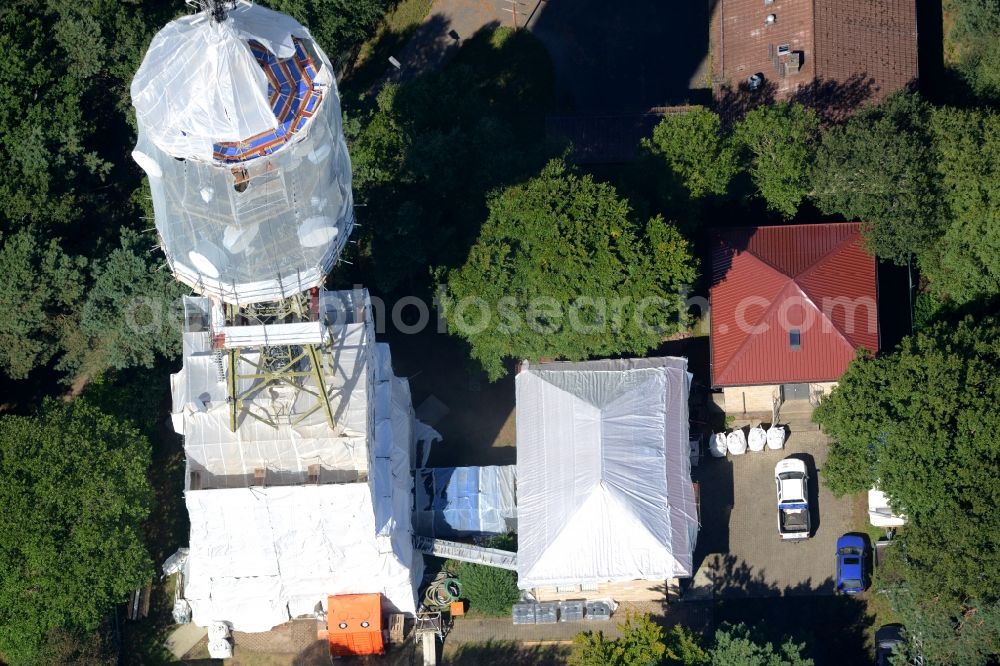 Maikammer from the bird's eye view: Radio tower and transmitter on the highest mountain of the Palatinate Forest, the Kalmit in Maikammer in the state Rhineland-Palatinate. Currently, renovation work will take place through the Werner Diener GmbH & Co. Industrieanstrich KG