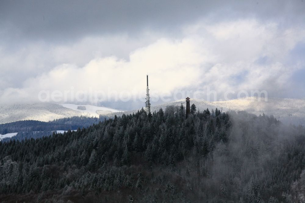 Schopfheim from the bird's eye view: Radio tower, lookout tower and transmitter on the top of the mountain Hohe Moehr in the Black Forest in Schopfheim in Baden-Wuerttemberg. Clouds and fog patches are passing over the snow-capped mountain peak