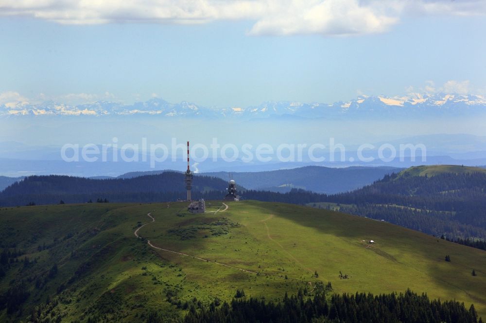 Feldberg (Schwarzwald) from above - Radio tower and transmitters on the crest of the mountain Feldberg (Schwarzwald) in the Black Forest in the state Baden-Wuerttemberg. Clear view to the Swiss Alps