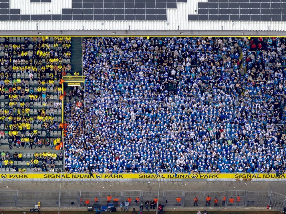 Aerial photograph Dortmund - Football fans on a stands in the Signal Iduna Park in Dortmund (formerly Westfalenstadion), the stadium of the football club Borussia Dortmund (BVB) in the state North Rhine-Westphalia