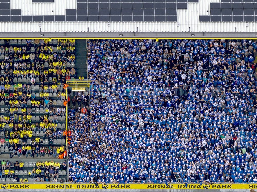 Dortmund from above - Football fans on a stands in the Signal Iduna Park in Dortmund (formerly Westfalenstadion), the stadium of the football club Borussia Dortmund (BVB) in the state North Rhine-Westphalia