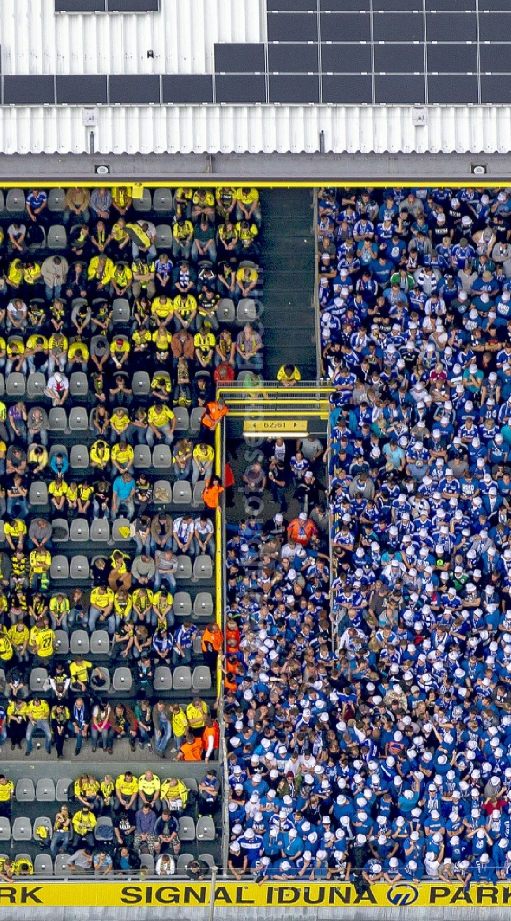 Dortmund from the bird's eye view: Football fans on a stands in the Signal Iduna Park in Dortmund (formerly Westfalenstadion), the stadium of the football club Borussia Dortmund (BVB) in the state North Rhine-Westphalia