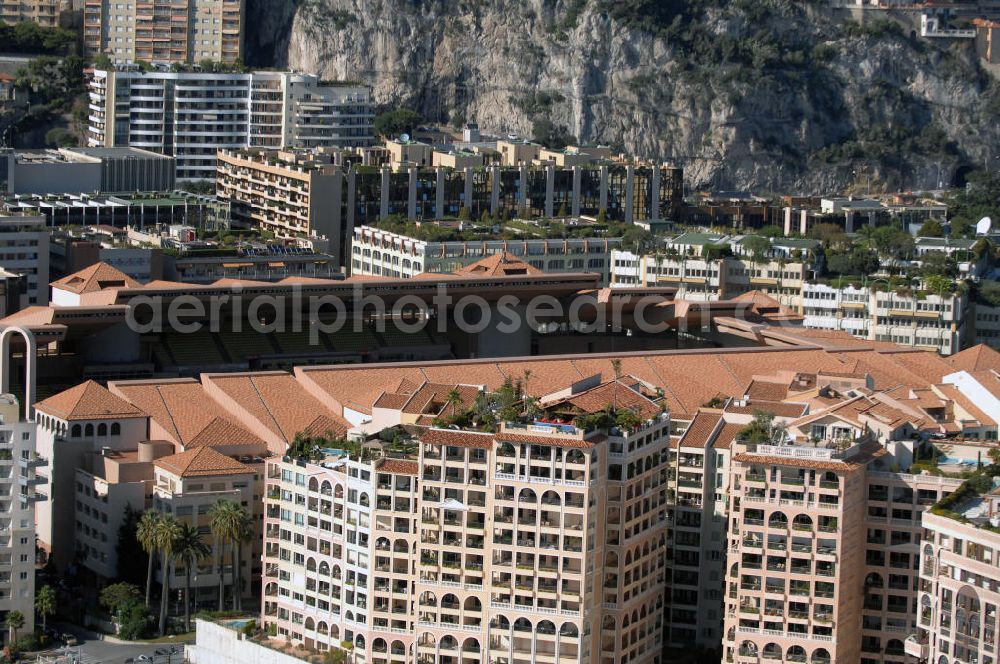 Aerial photograph Monaco - Blick auf das Fußballstadion Stade Louis II in Monaco. Das Stadion befindet sich im Stadtteil Fontvieille und wurde im Januar 1985 eröffnet. Die Besonderheit des Stadions ist, das sich das Spielfeld auf 8,5 Meter über der Straßenhöhe befindet, da es auf das viergeschossige Parkhaus gebaut wurde. Mit den großen Rundsäulen hinter den Toren ist die Architektur einzigartig. Das Stadion ist die Heimat des montegassischen Fußballvereins AS Monaco. Kontakt Verein: AS Monaco FC, Stade Louis II, BP698, 98014 Monaco Cedex, Tel. +377(0)9205 7473, Fax +377(0)9205 3688; Touistinfo: Administrative Information Centre, Avenue Albert II 23, MC 98000 Monaco, Tel. +377(0)9898 4026, Fax +377(0)9898 4086, Email: centre-info@gouv.mc