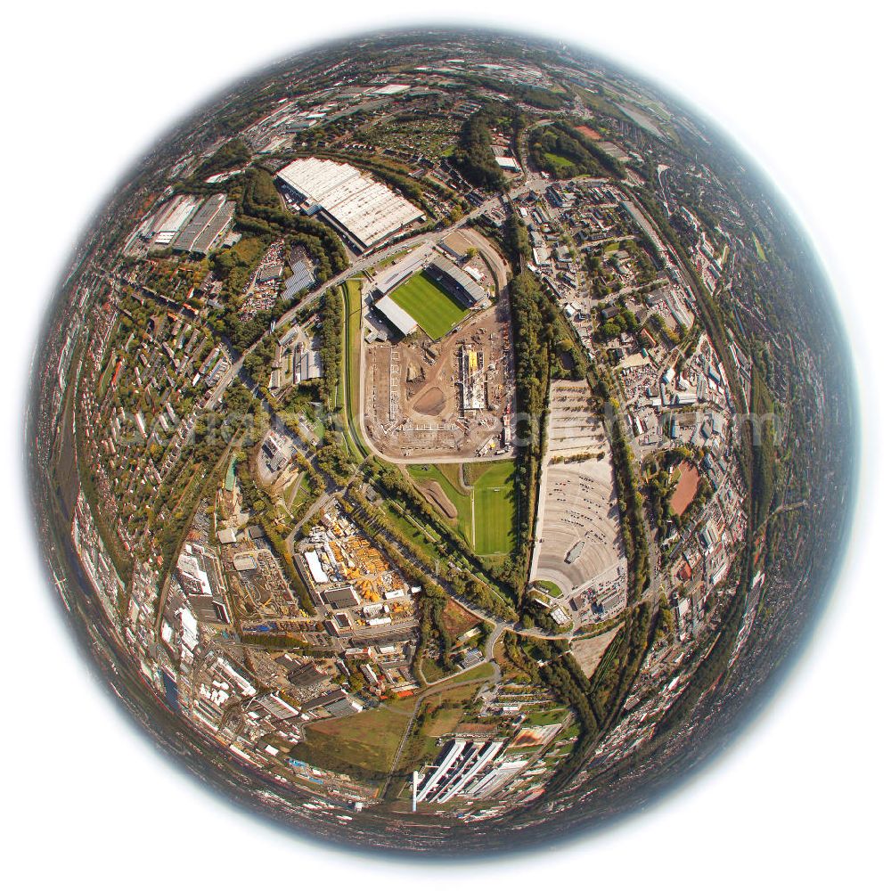 Essen from the bird's eye view: Fish Eye Motiv vom Umbau des Areales am Georg-Melches-Stadion vom Fußballclub Rot-Weiss Essen in der Stadt Essen, Nordrhein-Westfalen. Es wird ein neues Fußballstadion, welches ca. 20000 Zuschauern Platz bieten soll, leicht versetzt in unmittelbarer Nachbarschaft gebaut. Für die Arbeiten wurde das Bauunternehmen Köster Bau AG beauftragt. Construction of a modern football stadium at the Georg-Melches stadium in Essen, North Rhine-Westphalia.