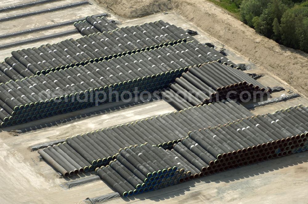 Aerial photograph MUKRAN - Blick auf die Lagerflächen für die angelieferten Gasleitungsrohre zur geplanten Ostseeleitung auf dem Gelände des Fährhafen Mukran bei Saßnitz auf der Insel Rügen. In den nächsten Monaten sollen insgesamt rund 65 000 Gasleitungssegmente per Bahn nach Mukran geliefert und dort auf mehreren Freiflächen deponiert werden. Im Hafengelände wird derzeit ein neues Werk der nordfranzösischen Firma EUPEC errichtet, in dem die 12,20 Meter langen Rohrsegmente vor ihrer Verlegung in der Ostsee mit Schwerbeton ummantelt werden sollen. Die 1220 Kilometer lange Gastrasse der Nord Stream AG soll voraussichtlich 2010 mit Spezialschiffen vom russischen Vyborg nach Lubmin verlegt werden. Künftig sollen jährlich bis zu 55 Milliarden Kubikmeter Erdgas durch die geplanten beiden Leitungsstränge nach Europa fließen.