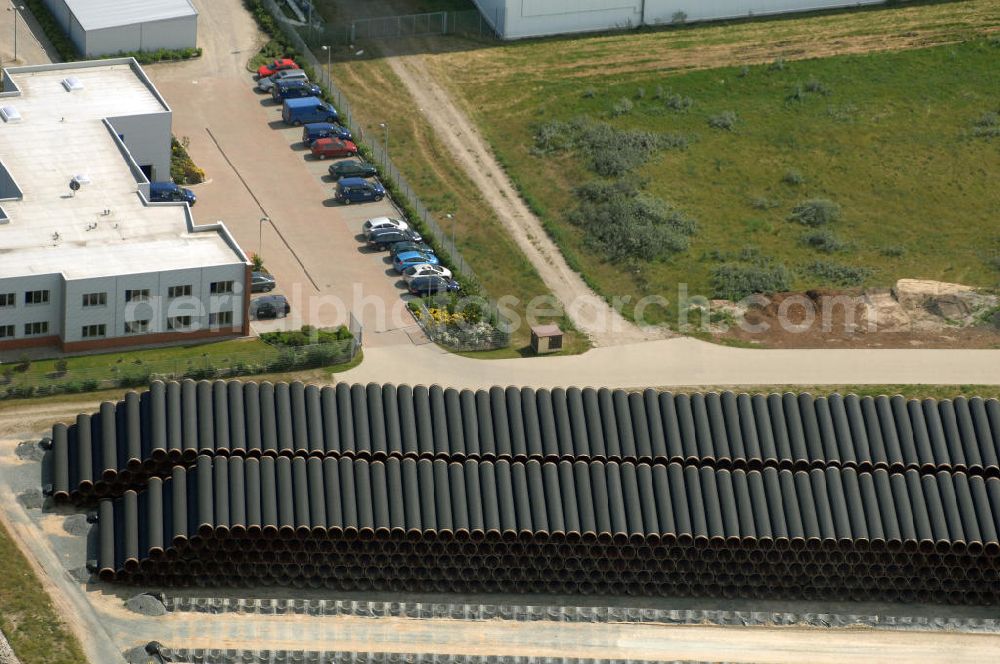 MUKRAN from the bird's eye view: Blick auf die Lagerflächen für die angelieferten Gasleitungsrohre zur geplanten Ostseeleitung auf dem Gelände des Fährhafen Mukran bei Saßnitz auf der Insel Rügen. In den nächsten Monaten sollen insgesamt rund 65 000 Gasleitungssegmente per Bahn nach Mukran geliefert und dort auf mehreren Freiflächen deponiert werden. Im Hafengelände wird derzeit ein neues Werk der nordfranzösischen Firma EUPEC errichtet, in dem die 12,20 Meter langen Rohrsegmente vor ihrer Verlegung in der Ostsee mit Schwerbeton ummantelt werden sollen. Die 1220 Kilometer lange Gastrasse der Nord Stream AG soll voraussichtlich 2010 mit Spezialschiffen vom russischen Vyborg nach Lubmin verlegt werden. Künftig sollen jährlich bis zu 55 Milliarden Kubikmeter Erdgas durch die geplanten beiden Leitungsstränge nach Europa fließen.