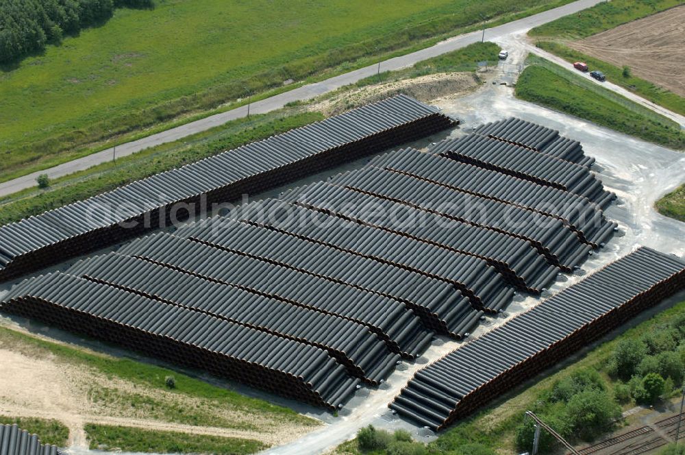 Aerial image MUKRAN - Blick auf die Lagerflächen für die angelieferten Gasleitungsrohre zur geplanten Ostseeleitung auf dem Gelände des Fährhafen Mukran bei Saßnitz auf der Insel Rügen. In den nächsten Monaten sollen insgesamt rund 65 000 Gasleitungssegmente per Bahn nach Mukran geliefert und dort auf mehreren Freiflächen deponiert werden. Im Hafengelände wird derzeit ein neues Werk der nordfranzösischen Firma EUPEC errichtet, in dem die 12,20 Meter langen Rohrsegmente vor ihrer Verlegung in der Ostsee mit Schwerbeton ummantelt werden sollen. Die 1220 Kilometer lange Gastrasse der Nord Stream AG soll voraussichtlich 2010 mit Spezialschiffen vom russischen Vyborg nach Lubmin verlegt werden. Künftig sollen jährlich bis zu 55 Milliarden Kubikmeter Erdgas durch die geplanten beiden Leitungsstränge nach Europa fließen.