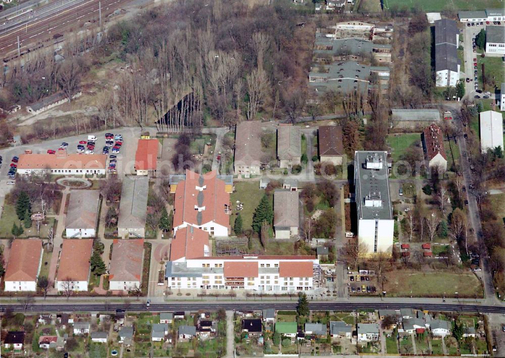 Aerial image Berlin - Building the retirement home Die Albert Schweitzer Stiftung - Wohnen & Betreuen on street Bahnhofstrasse in the district Blankenburg in Berlin, Germany