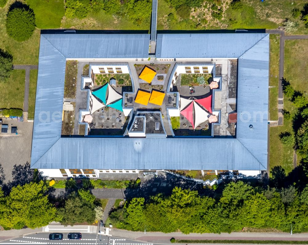 Aerial image Lennestadt - Building the retirement home of Caritas-Tagespflege Elspe overlooking the ruins of the old St. Franziskus-Haus on Bielefelder Strasse in the district Elspe in Lennestadt in the state North Rhine-Westphalia, Germany