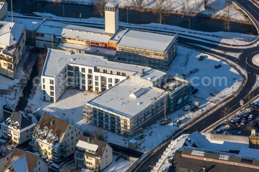 Aerial photograph Meschede - Wintry snowy building the retirement home Siedlungs- und Baugenossenschaft Meschede eG „Rinschen Park“ in Meschede in the state North Rhine-Westphalia